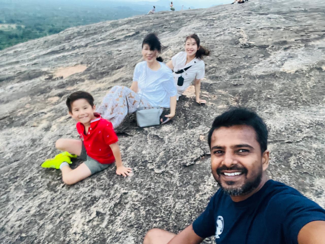 Family selfie on top of Sigiriya Rock at sunset